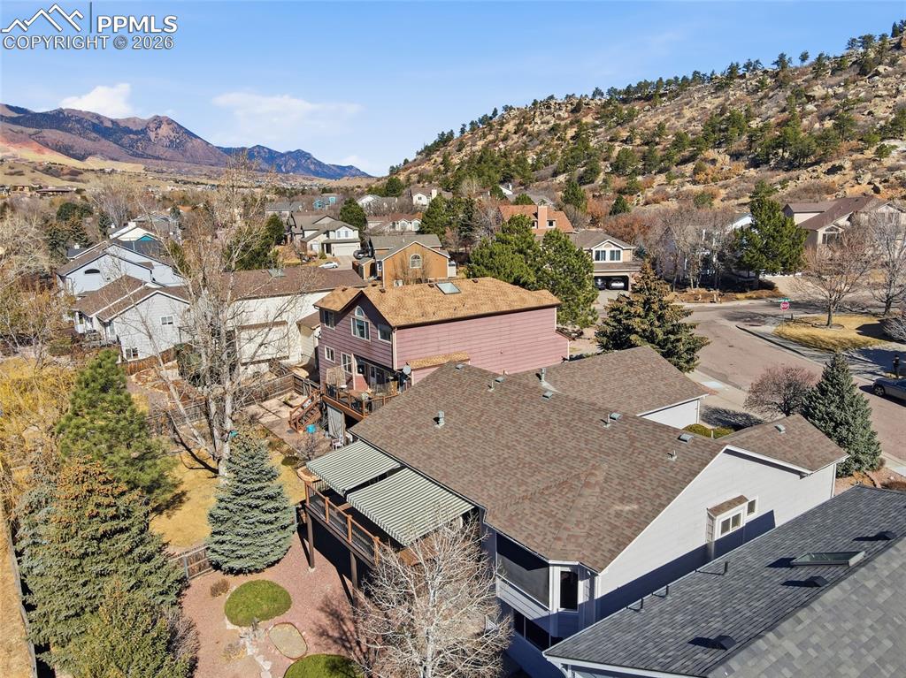 Aerial view of residential area featuring a mountain backdrop