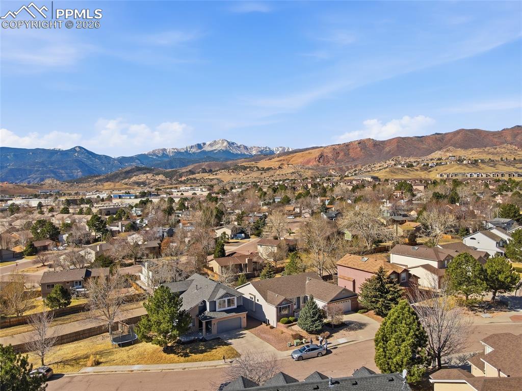 Aerial view of residential area with a mountainous background