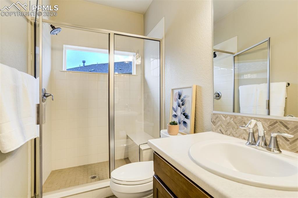 Bathroom on the main level next to the secondary bedroom. 