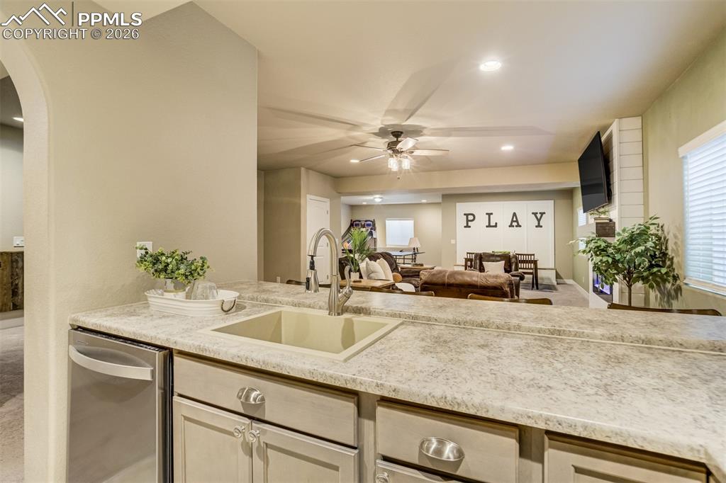 Sink, dishwasher, and full size fridge. 