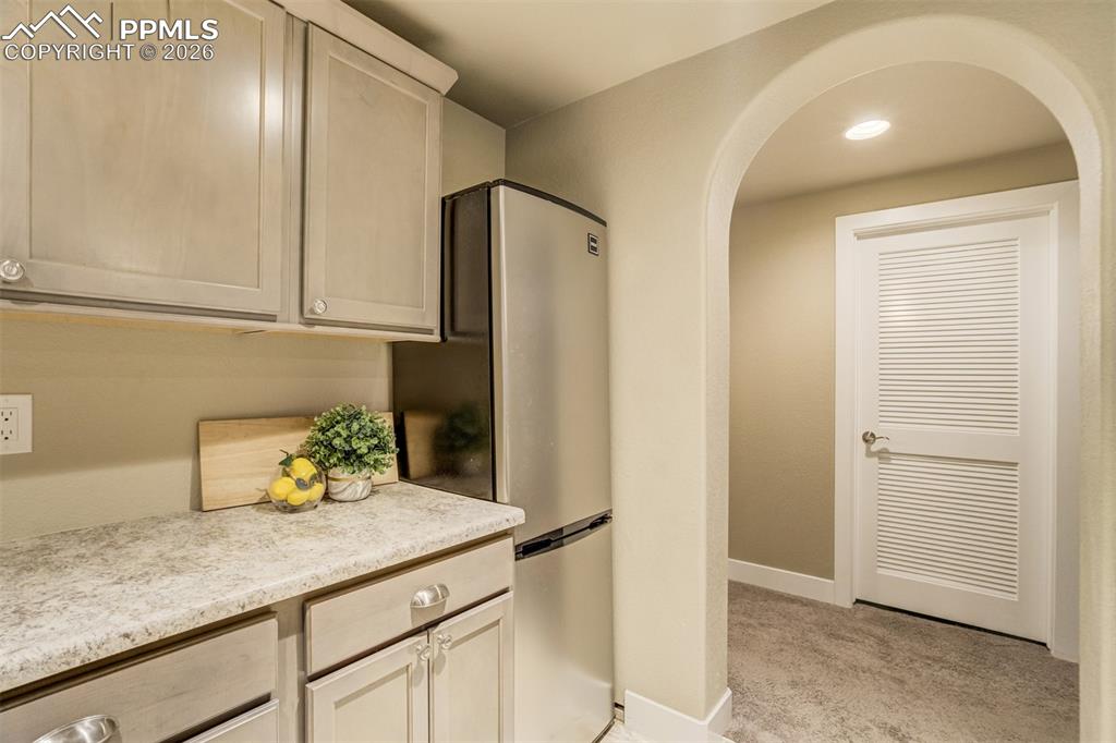 Architectural features like arched entryways add a luxury touch.  