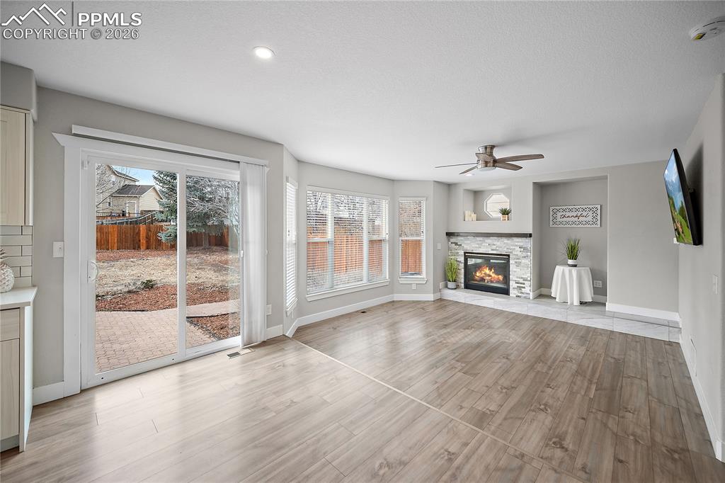 Walk out to fully fenced back yard with patio. 