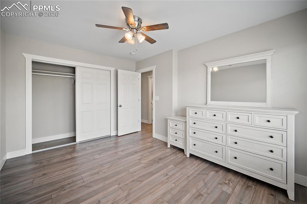 Upstairs bedroom with laminate flooring.
