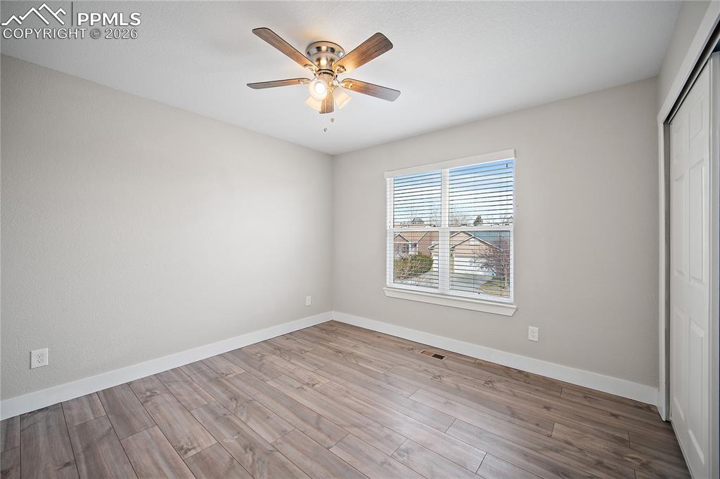 Upstairs bedroom with laminate flooring. 