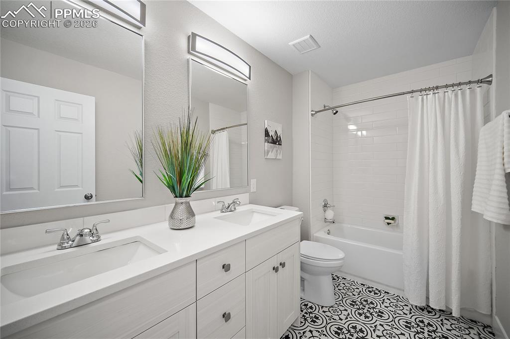 Updated upstairs full bath with double vanity. 