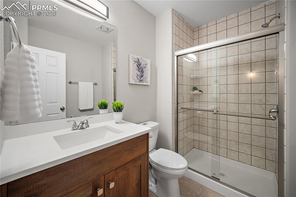 Basement 3/4 bath with newer vanity and sink. 
