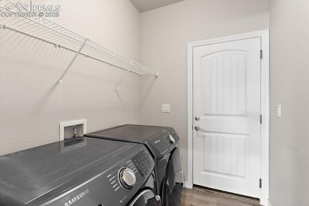 Main level laundry room and inside entrance to the 3-car garage