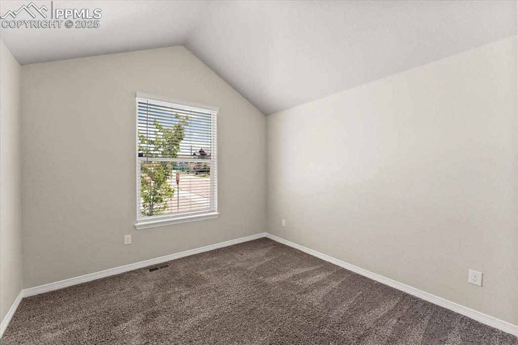 Main level bedroom that is staged as an office