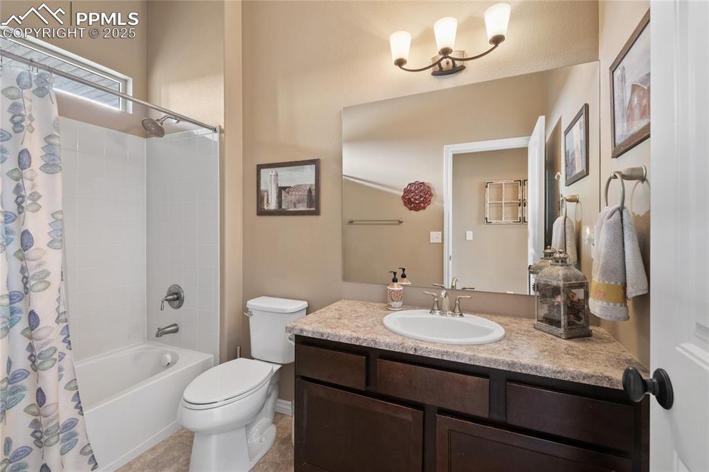 Main level full bath serves bedrooms 2 and 3. 