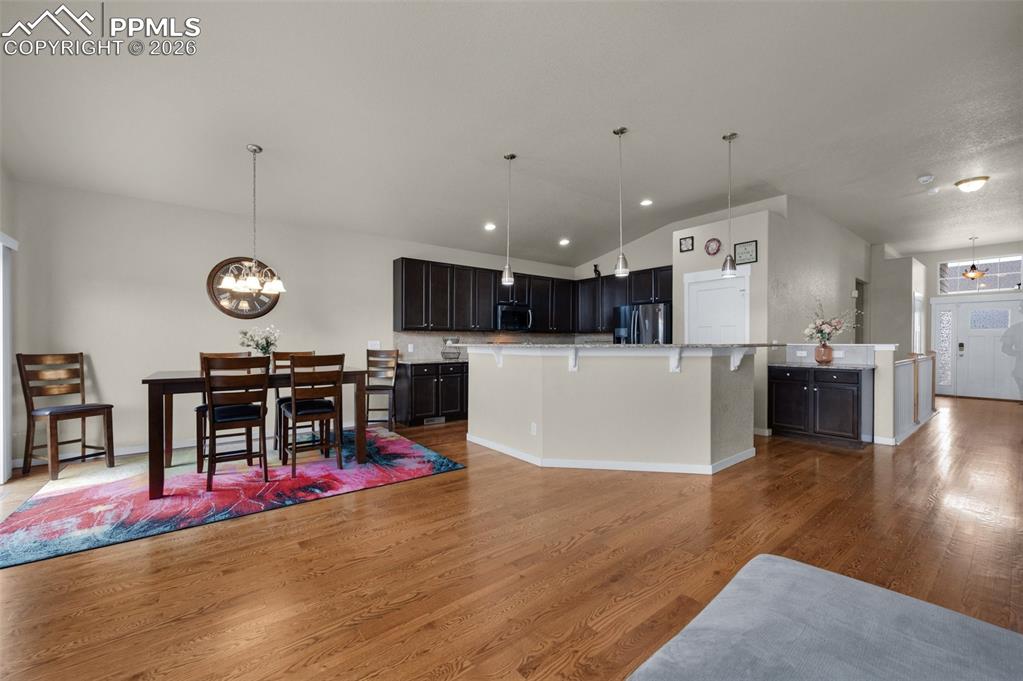 Kitchen and dining area with walk-out to backyard