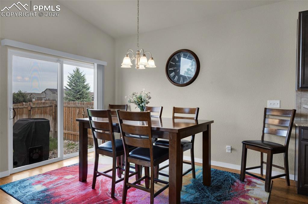 Dining space with plenty of natural light, and vaulted ceiling