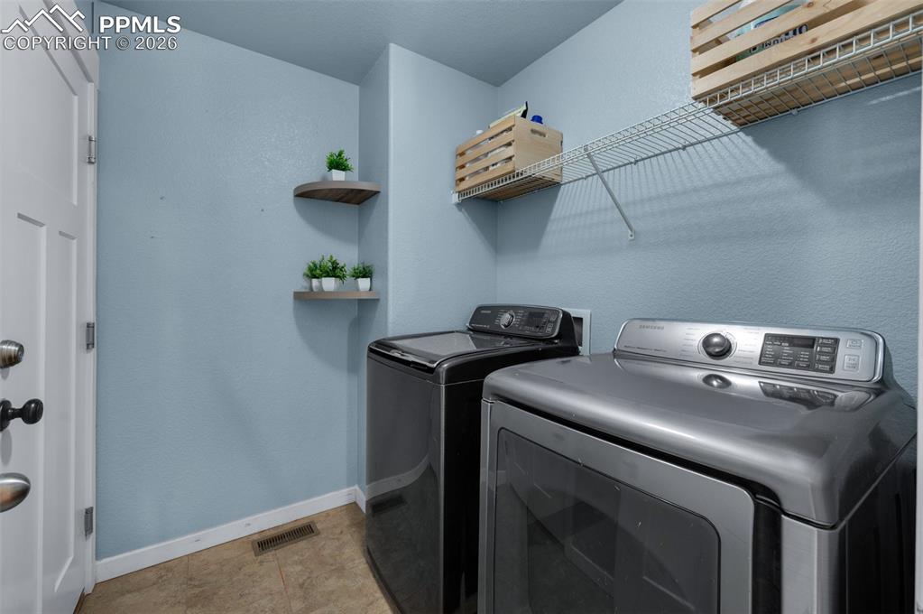 Main level laundry room, with door leading to garage.