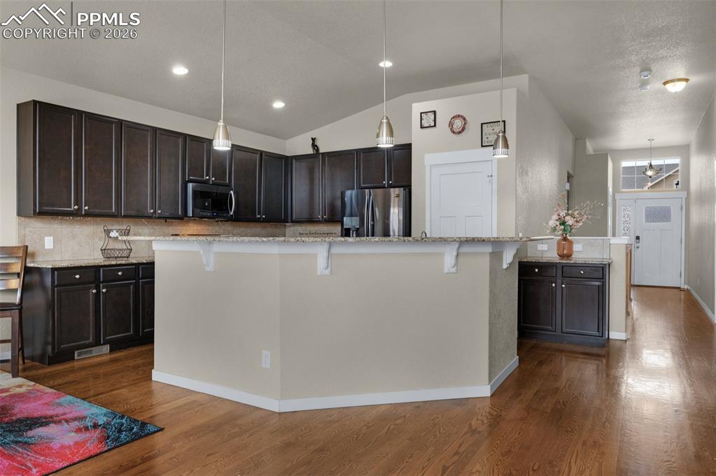 Kitchen with island and breakfast bar