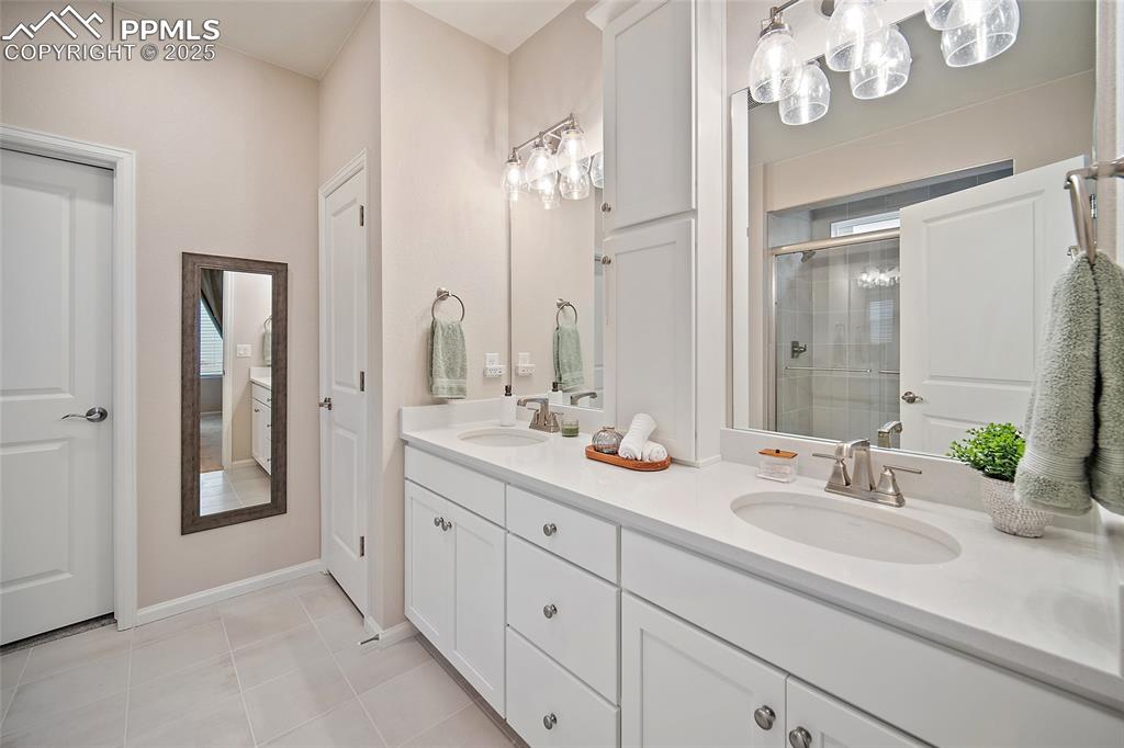 Double sinks with Quartz counter tops. 