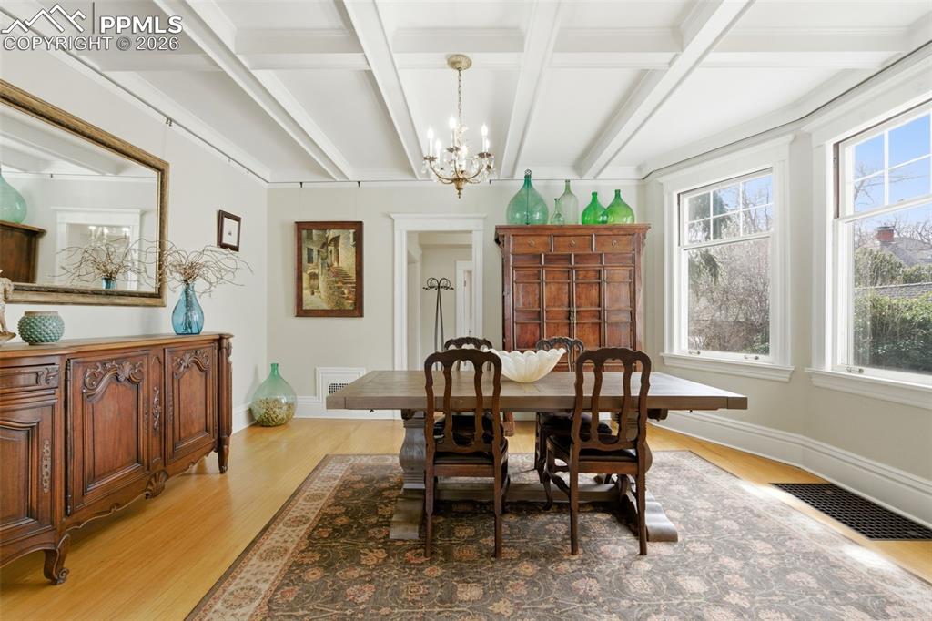 Formal Dining Room with lots of natural light and coffered ceilings