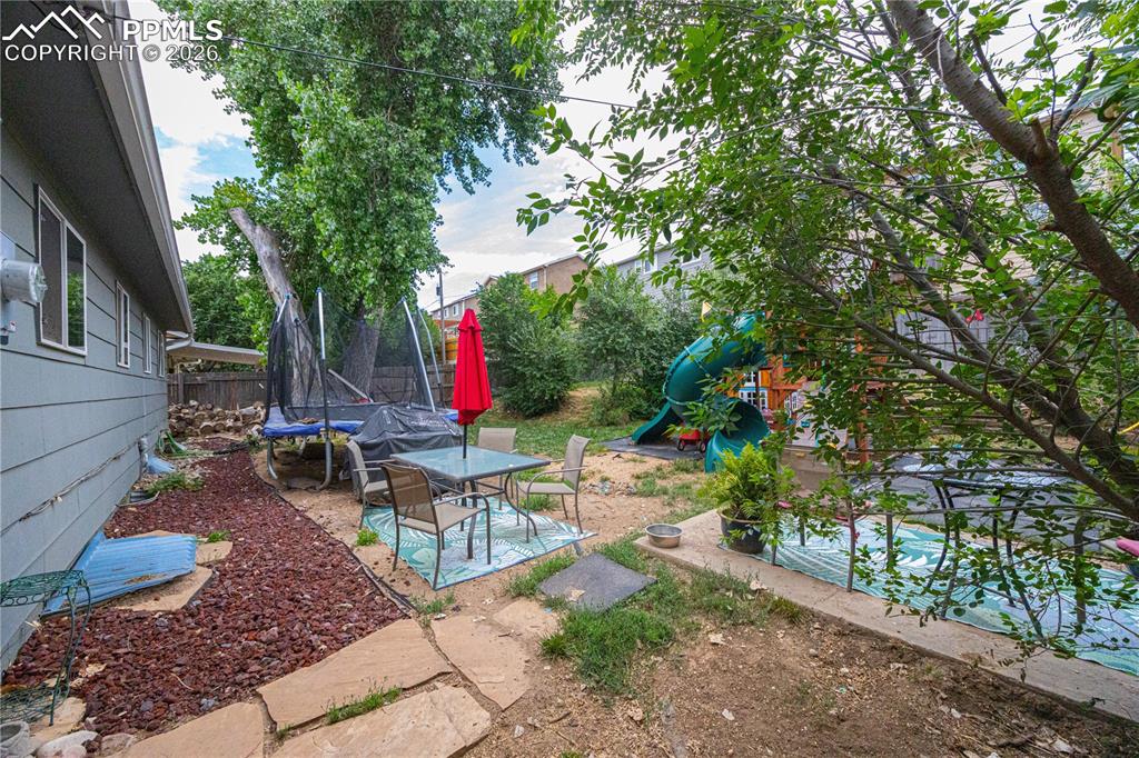 Rear yard, fully fenced with 6’ wood panels