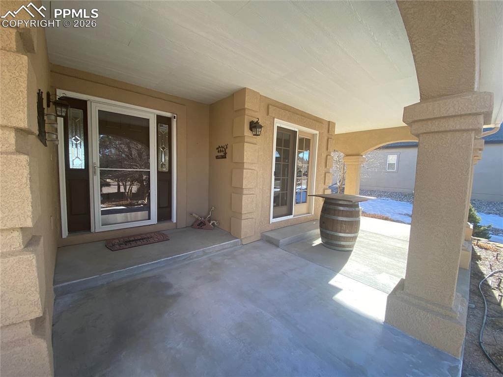 The front patio offers direct walk-out access from the master bedroom, perfect for enjoying mountain views and outdoor living