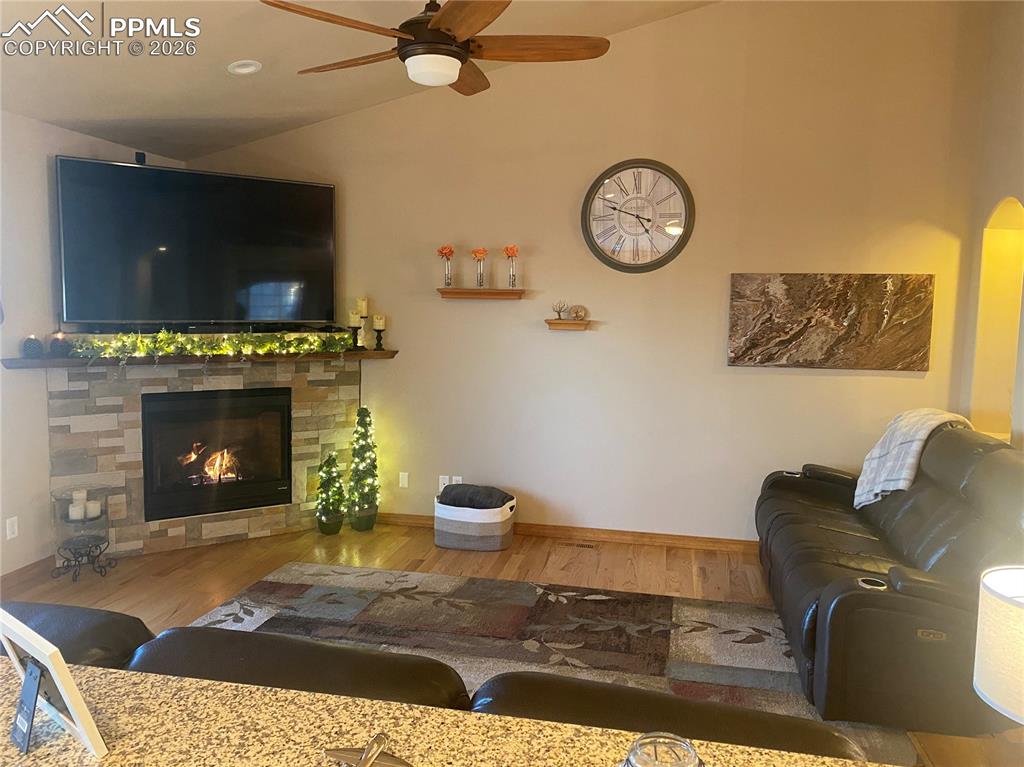 The cozy living room fireplace creates a warm, inviting atmosphere, with TV and wall mount included for instant entertainment