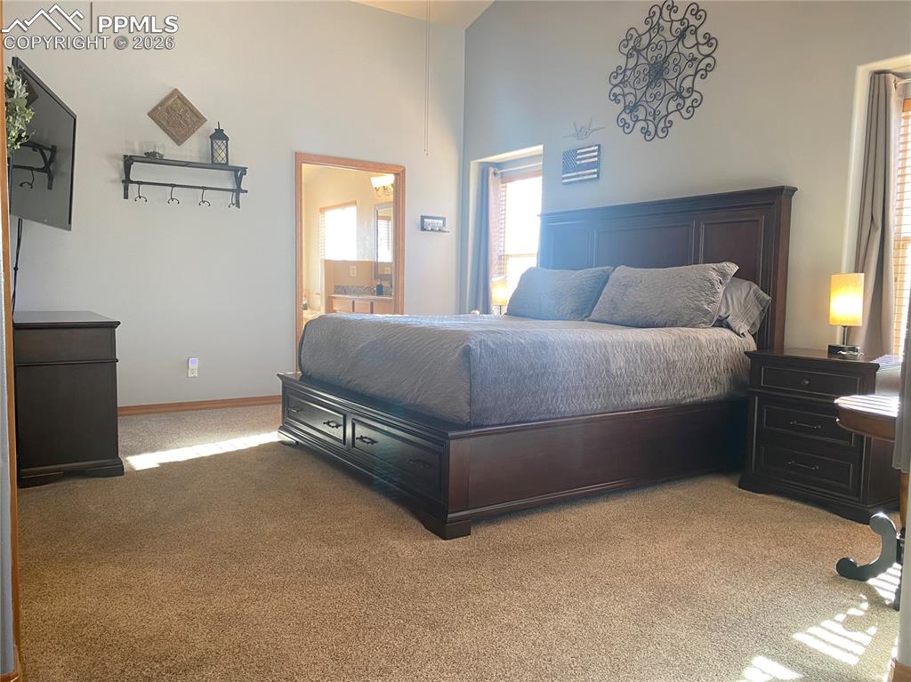 The master suite is filled with abundant natural light, creating a bright, airy retreat with scenic views and relaxing comfort