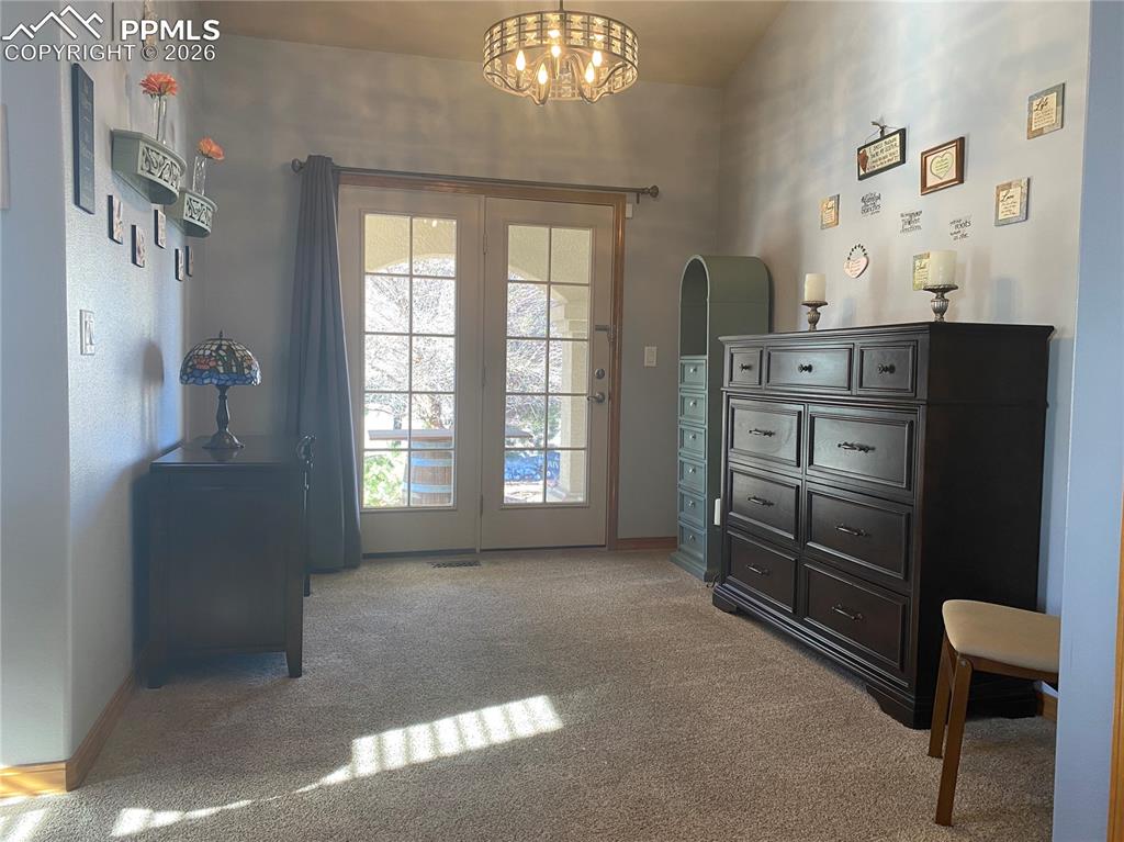 And a cozy sitting room with direct walk-out access to the front patio