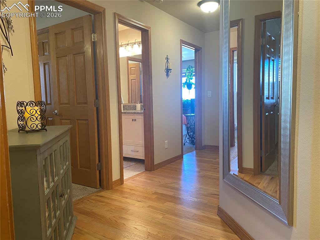 Two bright bedrooms and a full, updated bathroom are just down the hall, offering comfortable living space and convenient access for family and guests