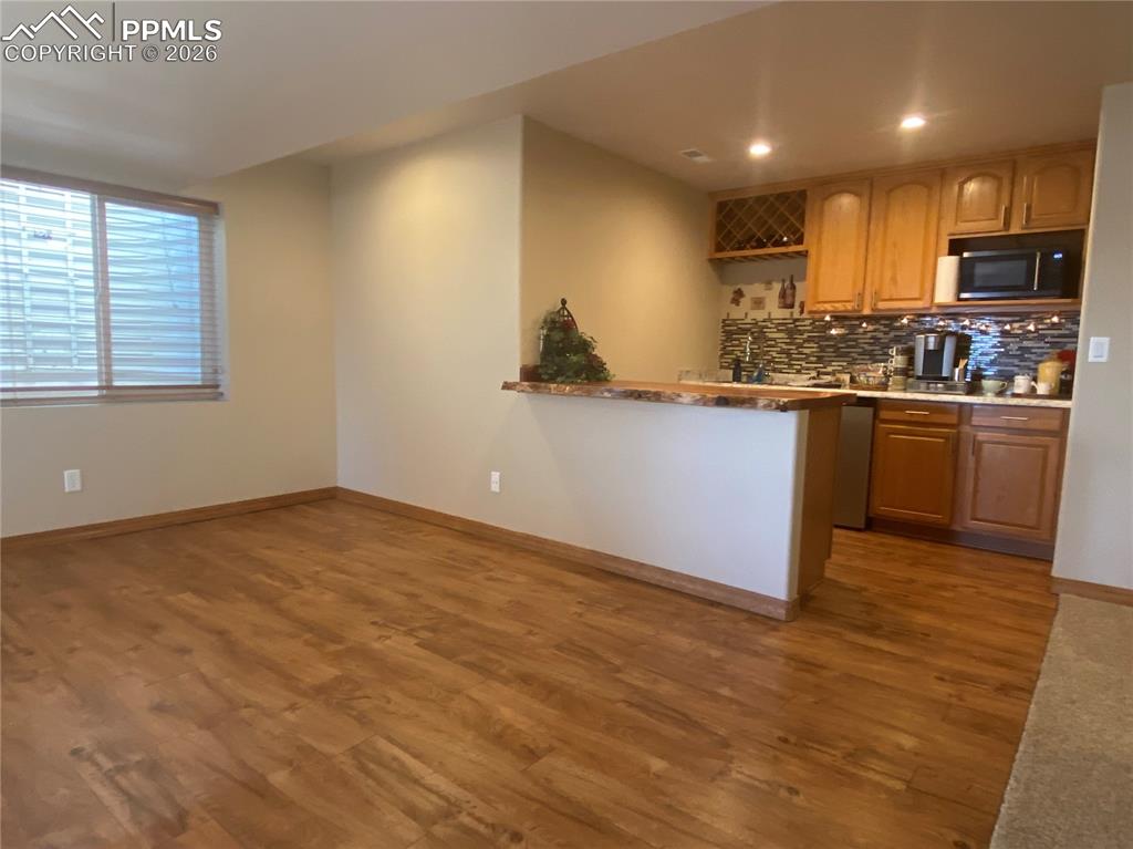 The finished basement features a bonus wet bar and second kitchen, adding flexible entertaining space for guests, multi-generational living, or a home theater setup.