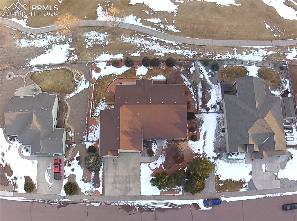 Over ¼ acre of fully landscaped yard with mature trees, outdoor living space, and low-maintenance design for entertaining and year-round enjoyment