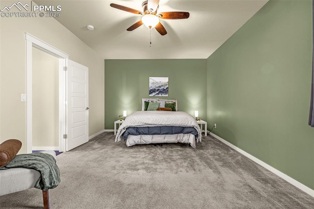Bedroom with carpet flooring and a ceiling fan