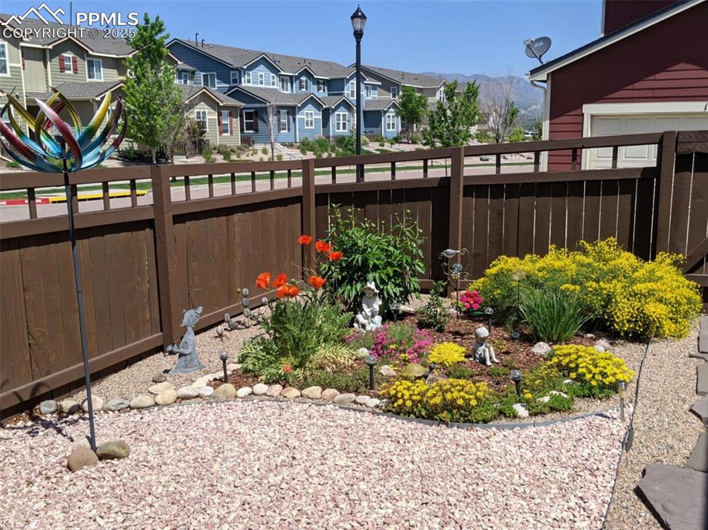 View of yard featuring a residential view and a mountain view