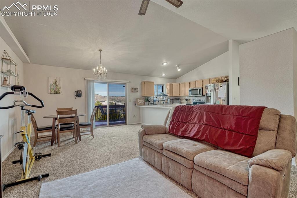 Living room, dining room and walkout to deck