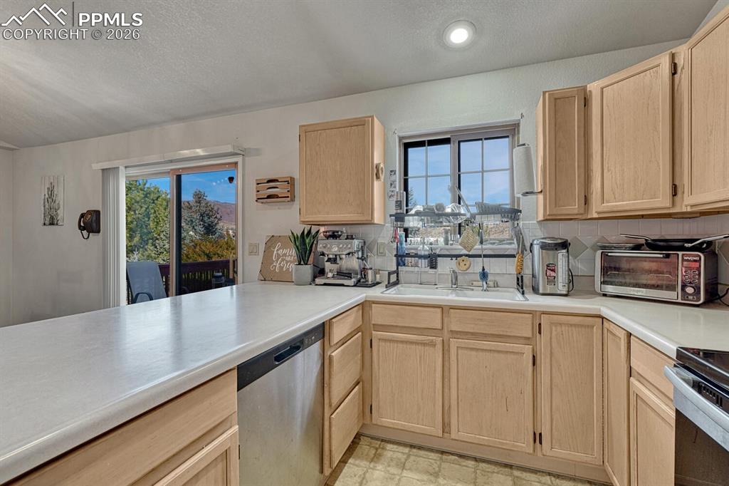 Large kitchen with walkout to deck