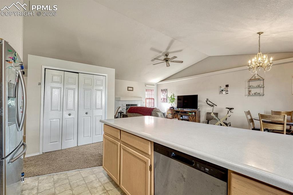 Kitchen opens to living room and dining room, large pantry.