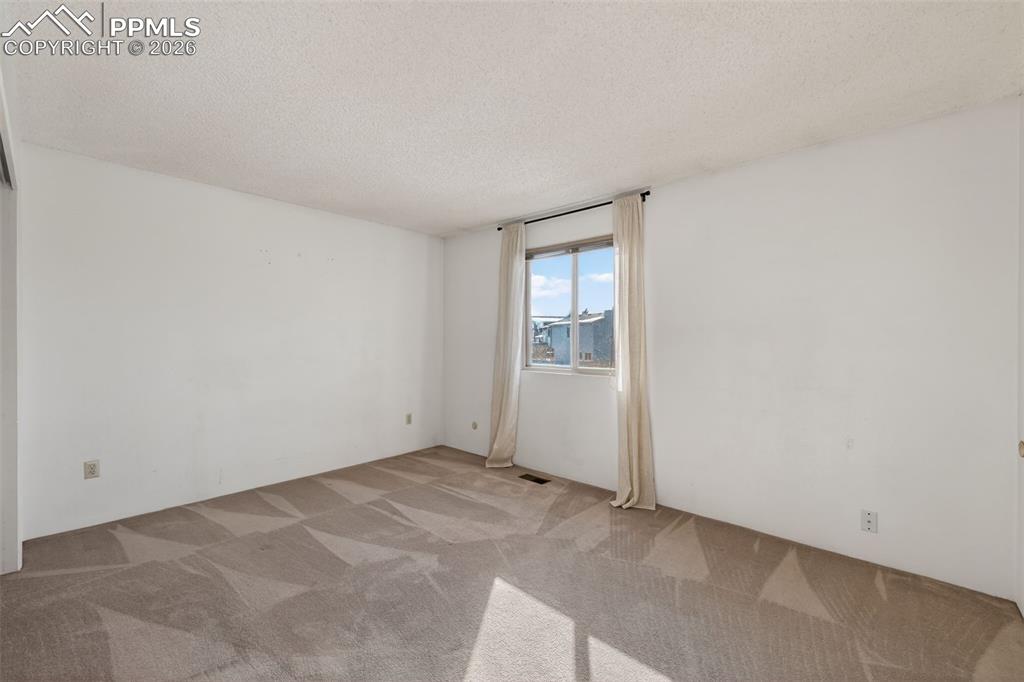 Primary bedroom features recently remodeled ensuite bath