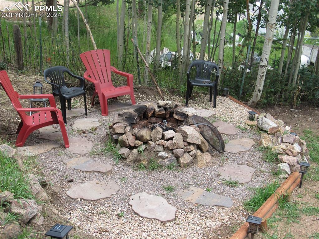View of patio / terrace featuring an outdoor fire pit