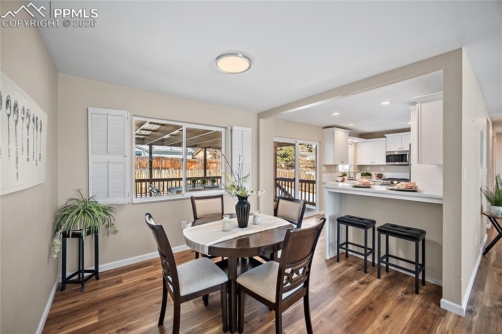 Large picture window,  breakfast bar, walk out kitchen.