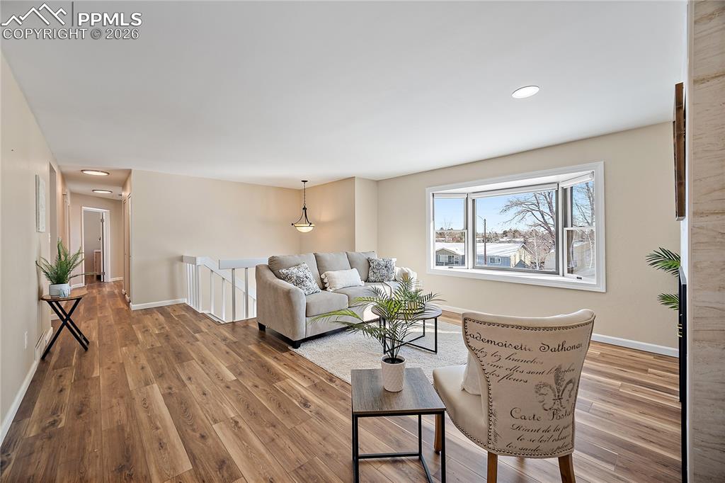 New flooring and fresh paint. Large bay windows allows tons of natural light. 