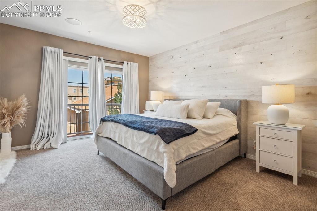 Upper Level Primary Suite with Patio Access