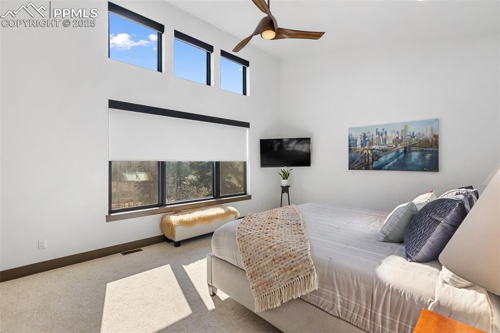 Gorgeous Pikes Peak views from this primary suite bedroom with automatic, programmable shades. 