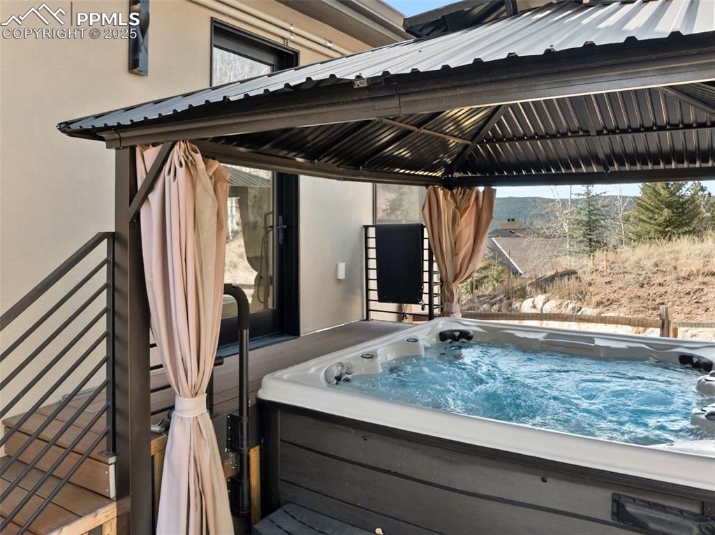 Walk out from primary suite to the hot tub!