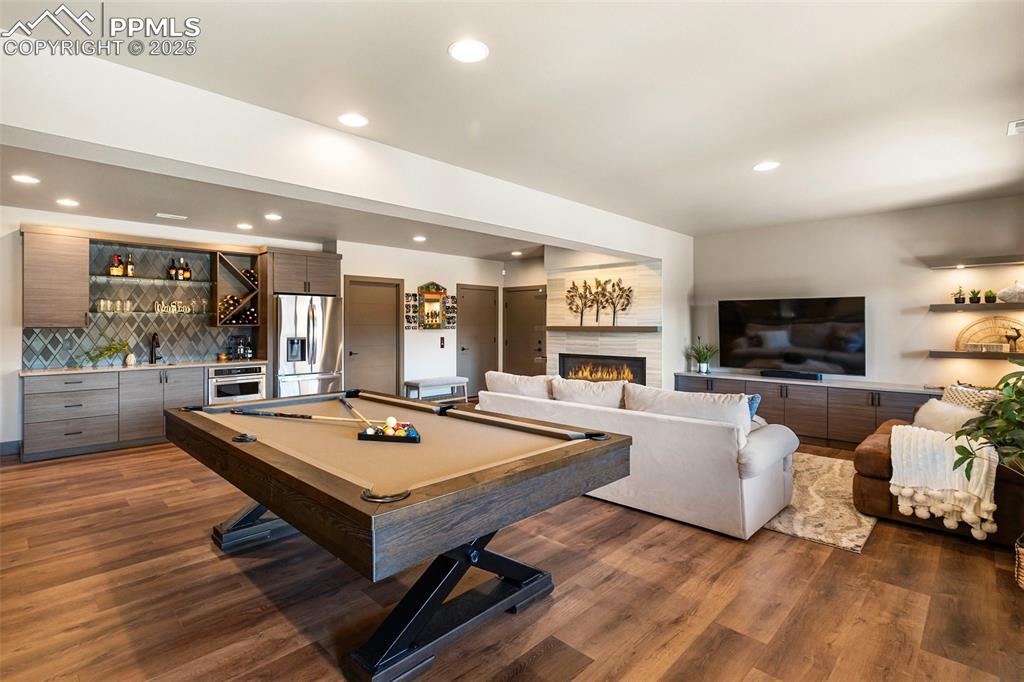 Lower level family room with walk out, wet bar, fireplace. 
