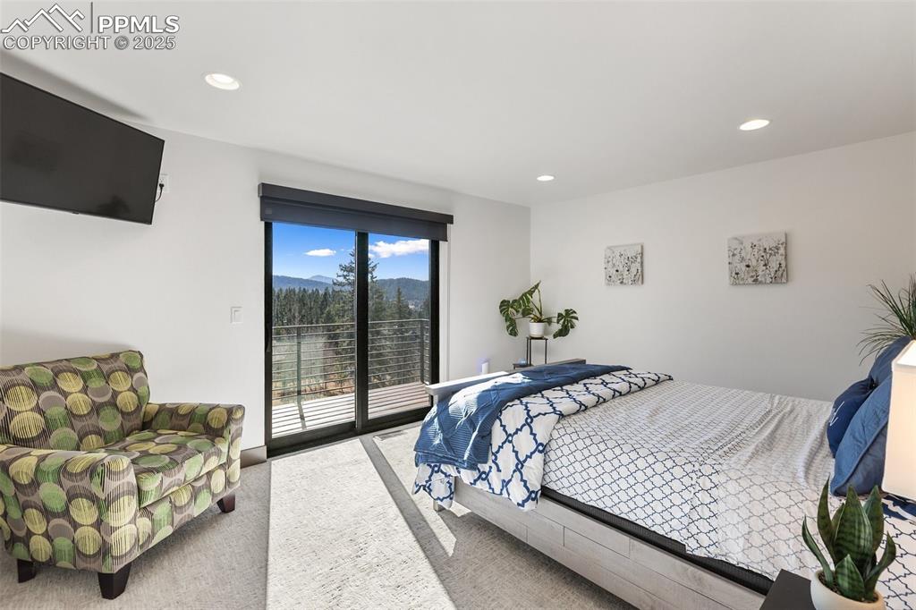 Upper level bedroom with private deck and walk in closet.
