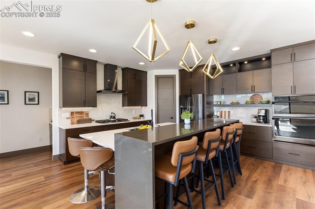 Separate cooktop, walk in pantry, double oven, and ample prep space in this high end kitchen! 