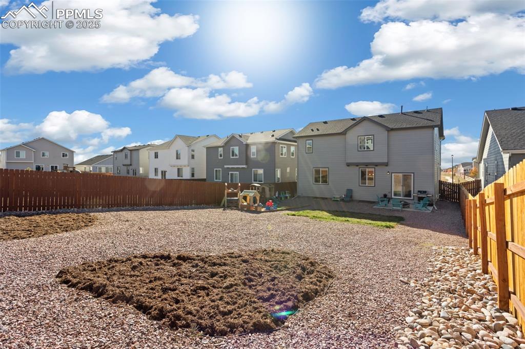 View of home's community featuring a fenced backyard, a patio area, a residential view, and a playground