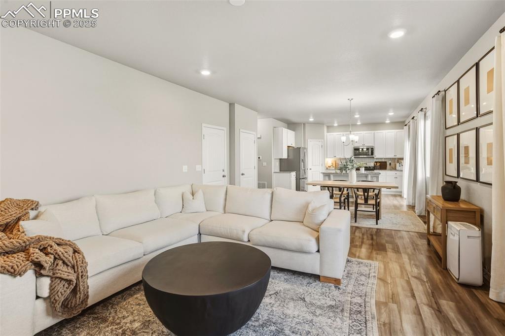 Living room featuring recessed lighting and light wood finished floors