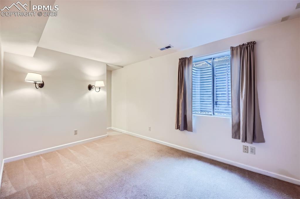 Carpeted bedroom with baseboards