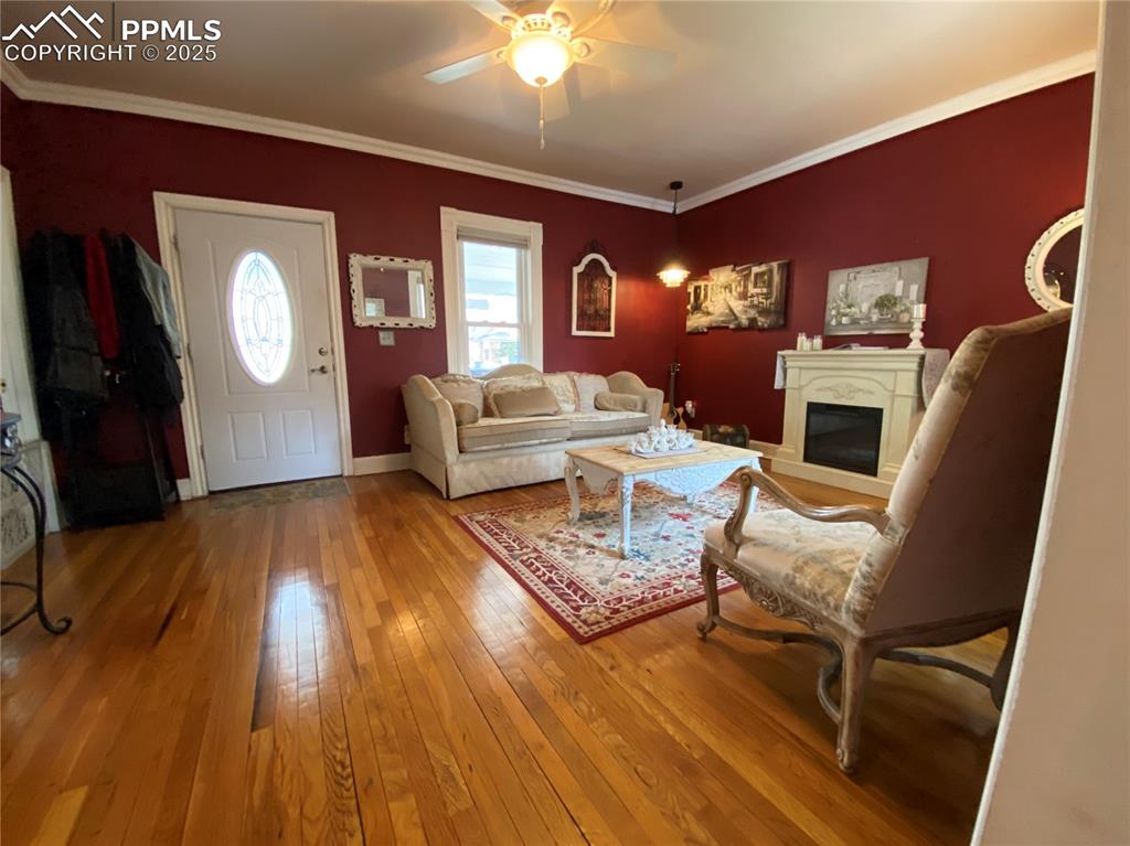 Elegant crown molding provides a sophisticated touch, enhancing the timeless character and beauty of this home.