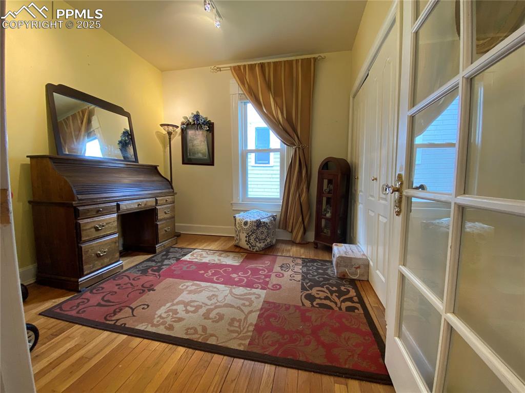The second bedroom features a beautiful French door, adding charm, natural light, and a touch of elegance