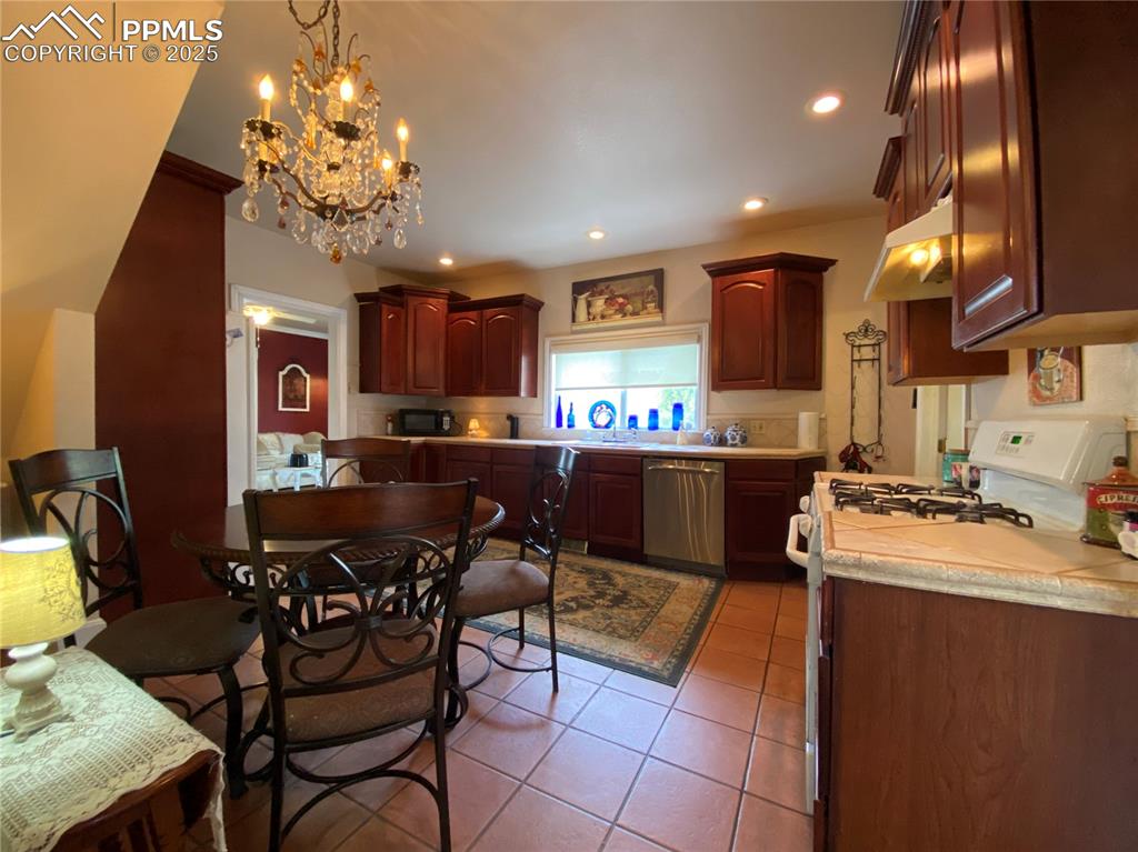 With newly updated cabinetry and elegant ceramic tile flooring, this kitchen is a functional and inviting centerpiece of the home.