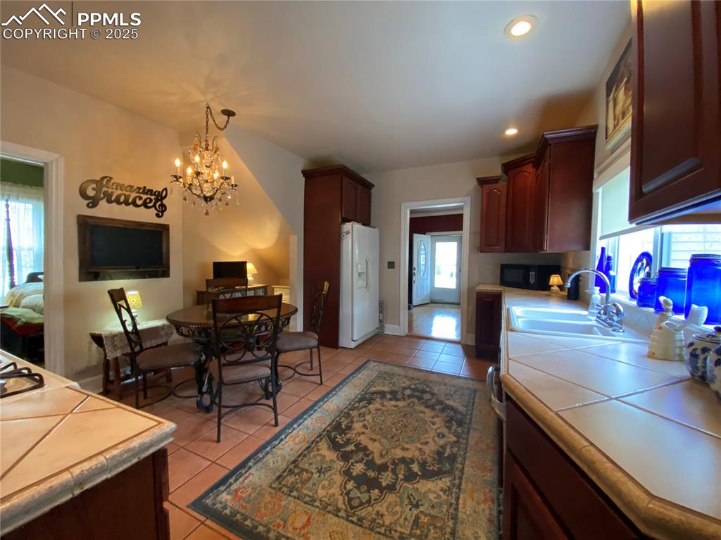 The eat-in kitchen combines convenience and functionality, ideal for family dining or casual meals