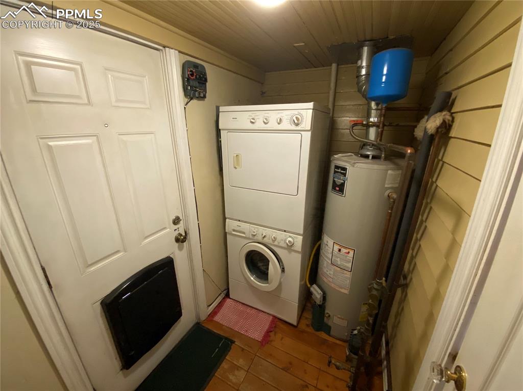 Enjoy the convenience of a main-level laundry area, neatly tucked into a custom-built space with plenty of storage and functionality.